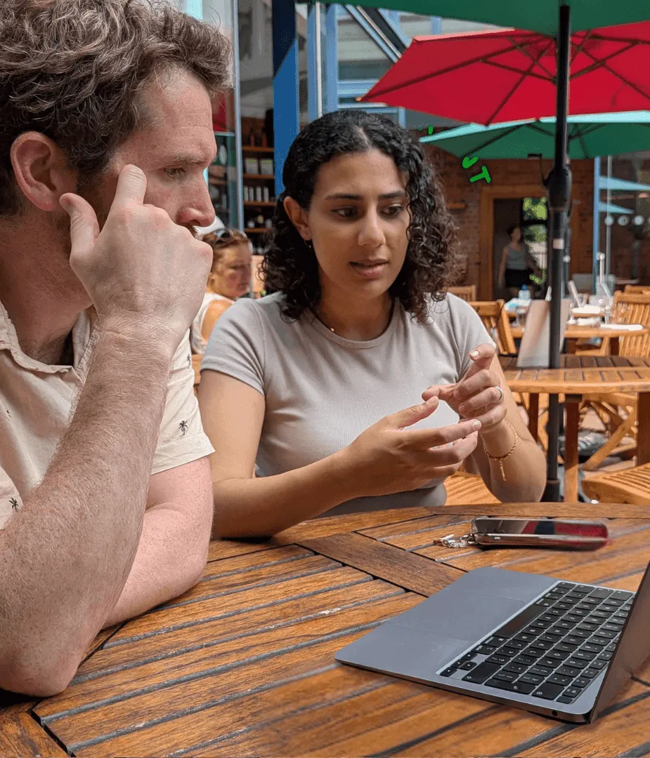 Jason and Sara working on a website